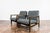 A pair of club chairs "type B7522," designed by Zenon Bączyk and produced in Poland in the 1960s, exemplifies the...