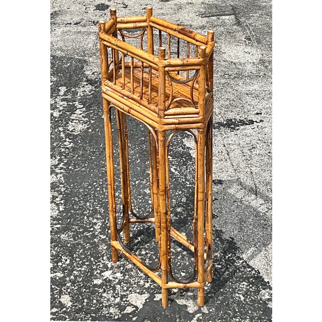 Bring organic charm and sculptural elegance to your space with this vintage boho octagonal bamboo plant stand. Featuring a...