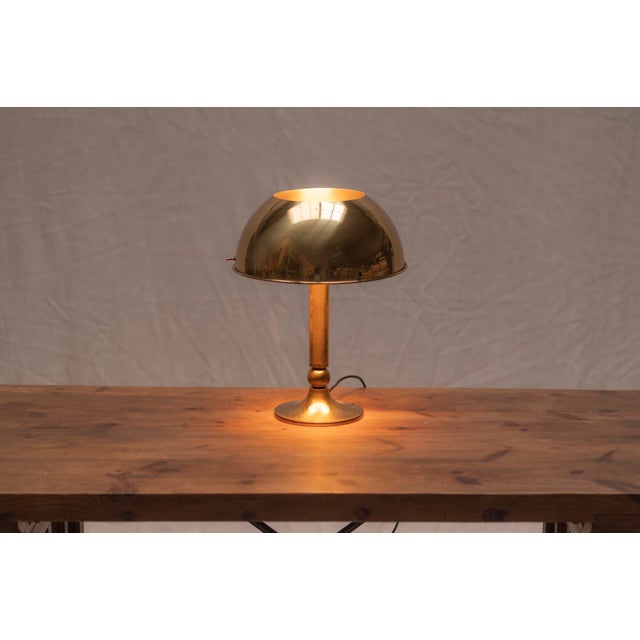 A beautiful example of mid-century German lighting, this brass table lamp was designed and manufactured by Florian Schulz...