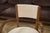 An elegant pair of walnut bridge chairs with a balanced and timeless design. Seats and backs reupholstered in ecru boucle...