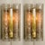 Wonderful pair off high-end Doria wall lamps. Manufactured in the 1960s. with textured and clear and amber spickled glass...