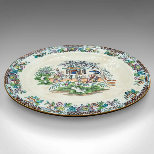 This is a large antique oval meat platter. A Chinese, ceramic dinner serving plate, dating to the late Victorian period,...