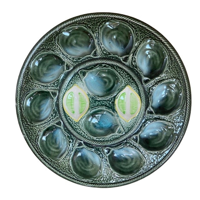 Superb Saint-Clément oyster service, in the most rarest and searched color. Platter measures 14,5 inch. This piece has an...