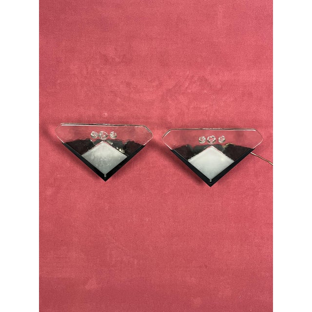 Set of 2 Murano glass wall lamps, 1970s Metal structure, halogen lamp. Glasses intact. Delicious expressions of the 70s....