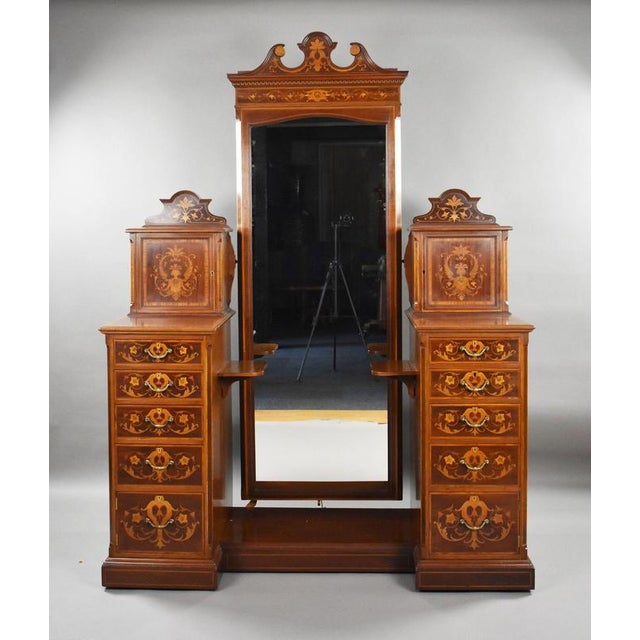 A superb and highly decorative late Victorian dressing table by the renowned London cabinetmakers Edwards & Roberts,...