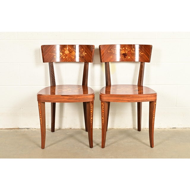 An outstanding pair of Italian Regency Louis XVI style side chairs or dining chairs Italy, Circa Early 20th Century...