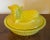 Canary yellow pressed glass butter dish or trinket box in the form of a molded lamb sitting atop a basket or nest....