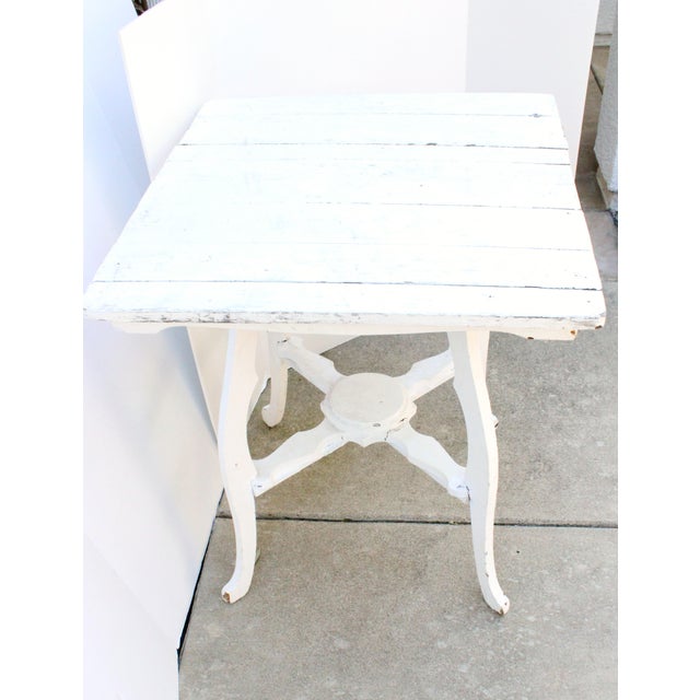 19th Century French side table in weathered white finish with shaped stretchers. Want to explore more products at...