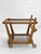 French design bar cart by Guillerme et Chambron, circa 1960, crafted from oak with smoked glass shelves. It features a...
