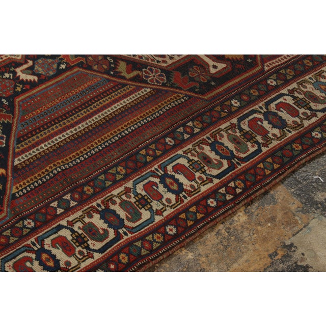 Hand-knotted in fine wool, an antique Qashqai rug from Persia circa 1920-1930 joining Rug & Kilim’s coveted Antique &...