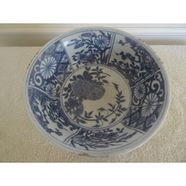 Beauitful bowl on intracate carved stand circa 1920s. The rim of the antique bowl has firing flaws which add to the...