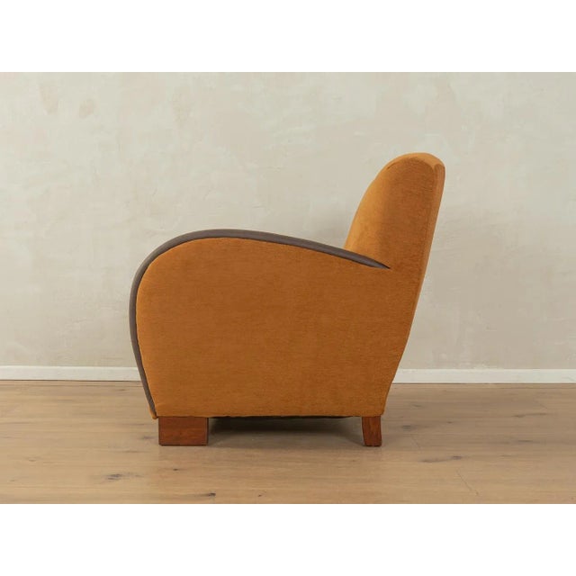 A wonderful Art Deco armchair from the 1930s. High-quality solid wood frame. The original spring core has been...