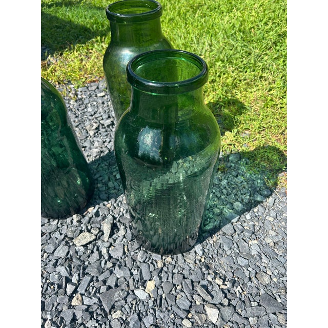 A collection of 3 German large antique bottle green pickling jars. Makes a wonderful trio. Opening measures 4.75 diameter