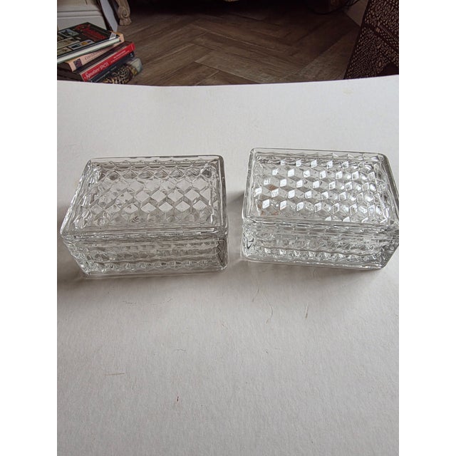 Pair of vintage Fostoria glass boxes with lids. One has an original sticker.