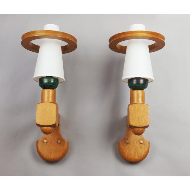 Pair of solid light oak wall lights adorned with black and green ceramic cups, created by Guillerme and Chambron around...