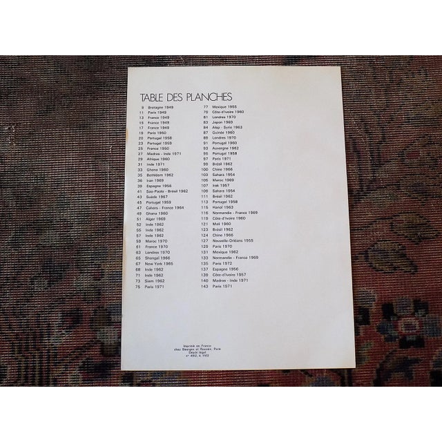 Each of these mid century photographs by famed photographer Edouard Boubat (Fr. 1923-1999) depicts people in everyday...