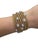 This stylish bracelet is in a wrap design with rose gold bands and white gold stations set with round brilliant cut...