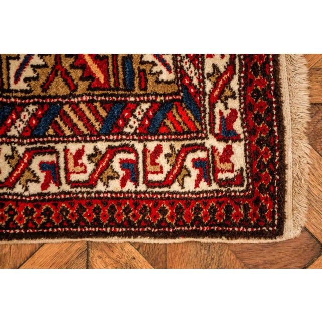 High-quality rug from the Eastern Caucasus. Motif of a central field with four medallions. Rich borura in seven stripes...