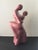 A vintage Haeger Pottery ceramic sculpture depicting a couple dancing the tango. The figures feature a dusty rose color...