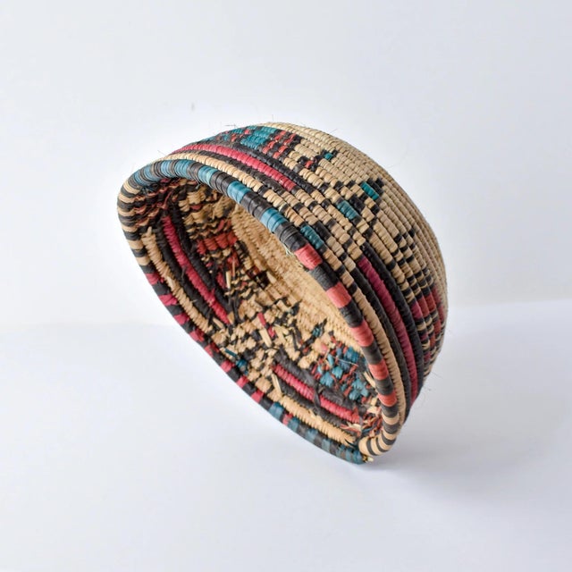 This vintage handmade basket bowl, crafted by the Hausa people of Northern Nigeria, are exquisite examples of traditional...