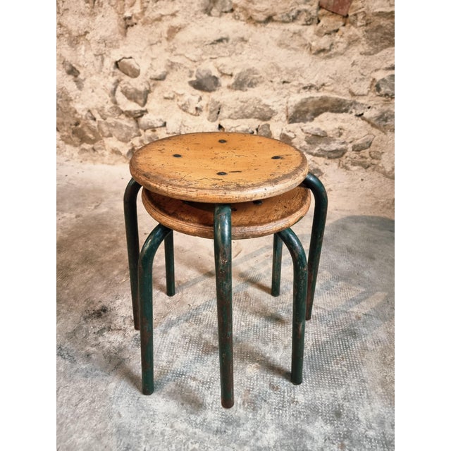 This vintage pair of French industrial stools features an honest and well-worn look from decades of use. Originally used...