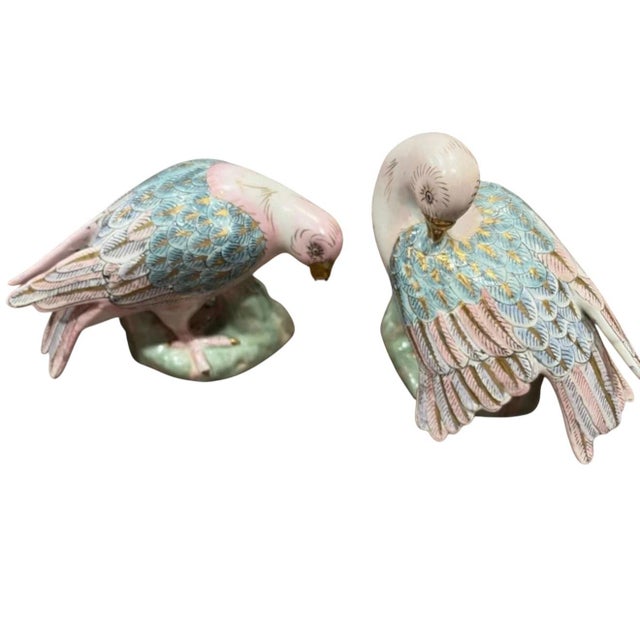 Striking vintage Chinese porcelain parrot figurine featuring an elaborate hand-painted design in soft blush pink,...