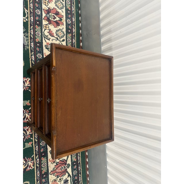 Discover the charm and utility of the Ashford Three Drawer End Table. Whether it's nestled beside your favorite armchair...