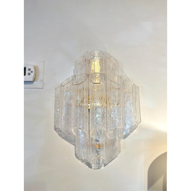 Elegant Baker Stella sconces. Textured glass tube shades, gold frame. Original Retail $4497 each. Showroom floor sample.