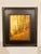 The painting depicts a serene autumn landscape, where golden hues dominate the scene, creating a warm and inviting...