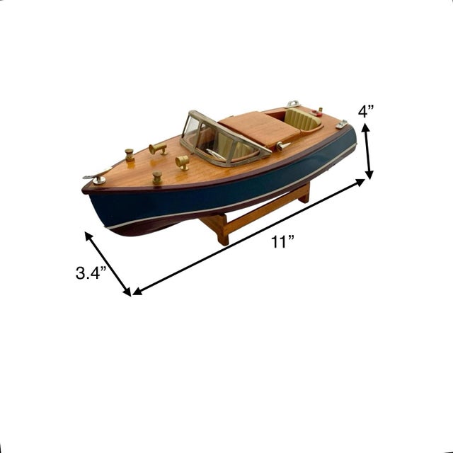 This vintage small boat is a luxurious addition to any home decor. Made of wood, it exudes a classic and timeless charm...