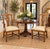 A handsome pair of mahogany armchairs in the Georgian style, featuring shaped crest rails, decorative pierced backs,...