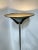 This Mid-Century Modern (MCM) floor lamp embodies the sleek and futuristic design sensibilities of the era. Crafted from...