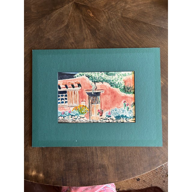 Beautiful Susan McCullough original watercolor of a Southwestern adobe scene. Matted with a forest green matt, framed in a...