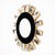 Sunburst mirror from Spain featuring a central circular mirror surrounded by a black glass frame. The mirror is made with...