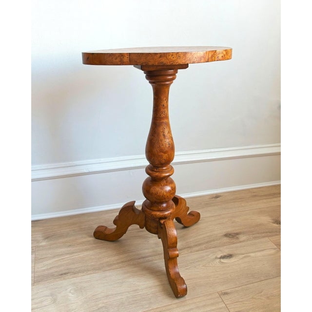 Antique 19th century solid maple burl wood pedestal side table. This unique Victorian era table features ornately carved...