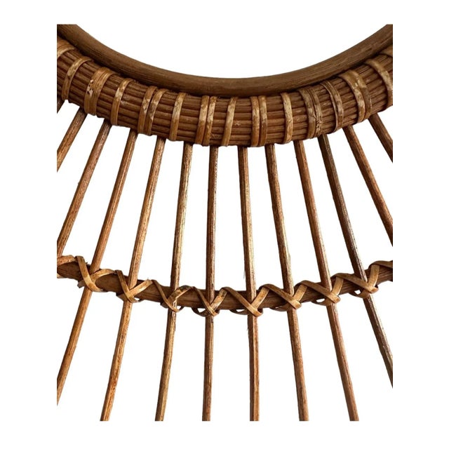 1970's rattan, Sunburst mirror, finely worked and woven with willow and reed. Complete with an inset 11-inch diameter...