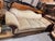Victorian sofa with three piece cushion seating. Carving detail on scroll arms.