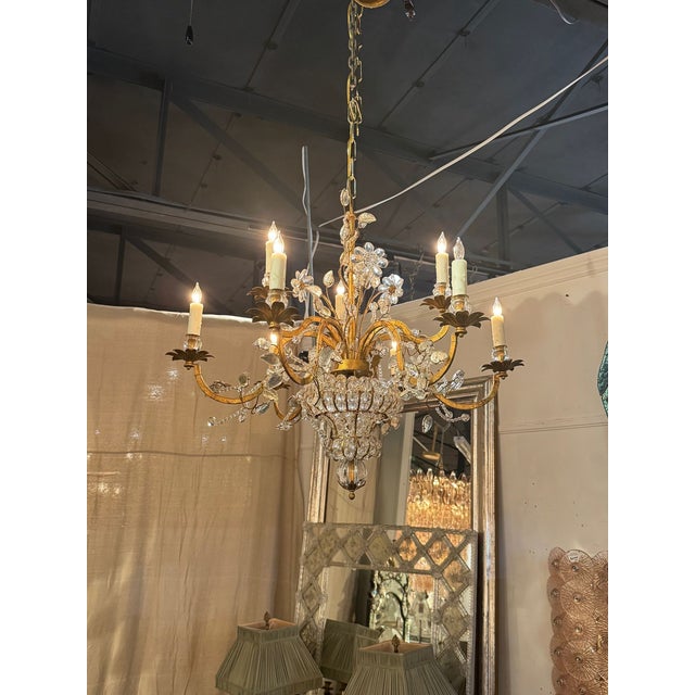 The Vintage French Bagues Crystal Flower Chandelier is a stylish and elegant lighting fixture. The unique design features...