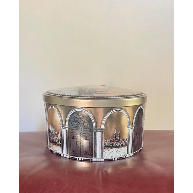 A vintage Schmitt metal box decorated with arches and a skyline view. Ships within 1-2 days using USPS. All items packed...