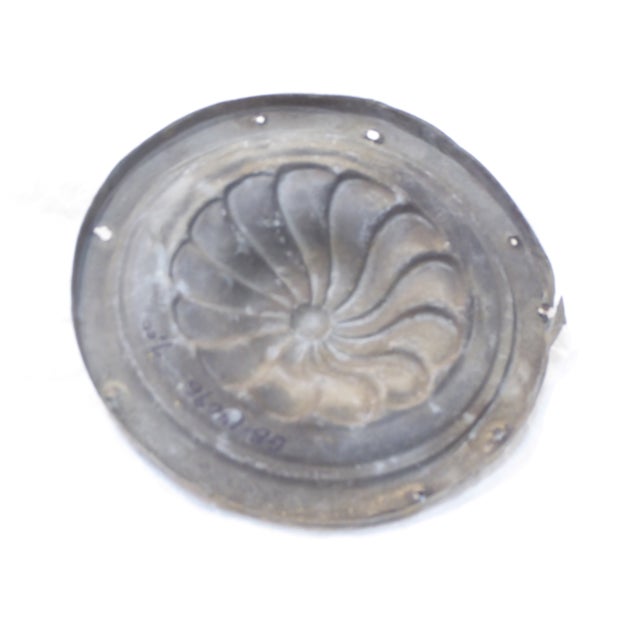 This architectural fragment has traces of old paint.