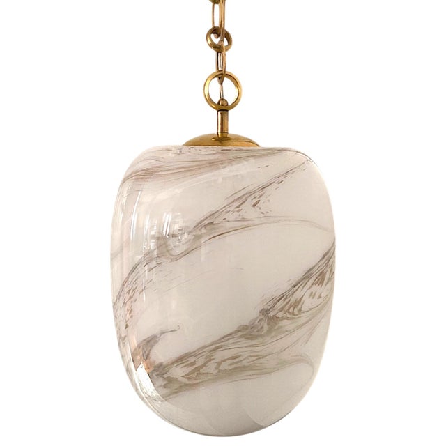 Transform any space with the soft, luminous glow of this Italian handblown faux alabaster glass pendant with brass chain,...
