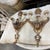 A pair of elaborately carved neoclassical painted sconces from Italy. This pair of mid 19th century scones have their...