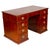 With rectangular top with inset red leather and banded edge, over a long drawer opening to A-Z lidded compartments. The...