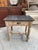 This antique butcher's table has been completely restored. It features a gray marble top and a carved beechwood base. It...