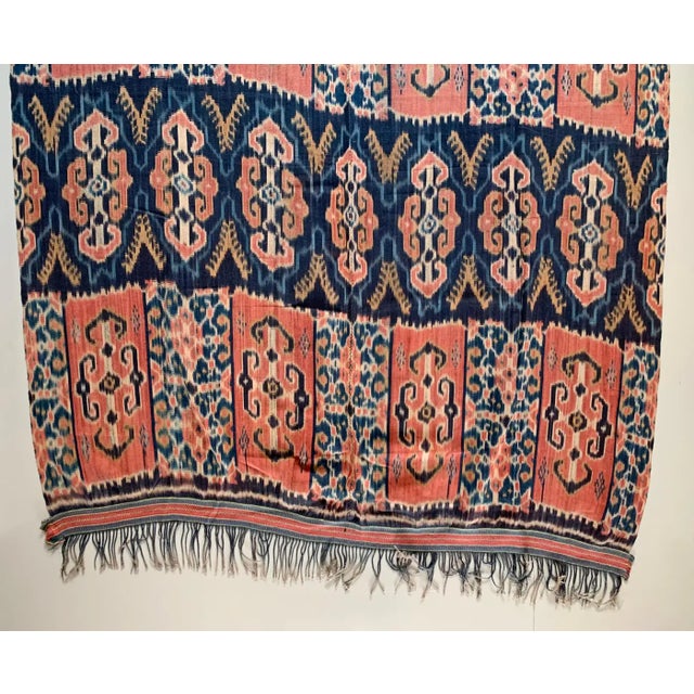 This Ikat textile originates from the Island of Sumba, Indonesia. It is hand-woven using naturally dyed yarns via a method...