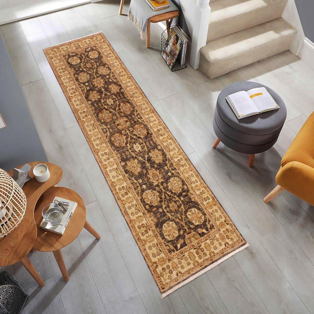 Enhance the ambiance of your home with this magnificent Persian-influenced Turkish hand-knotted rug made by skilled...
