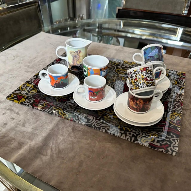 This vintage 1990s modern ceramic coffee service and matching plexiglass serving tray is a remarkably vibrant, collectible...