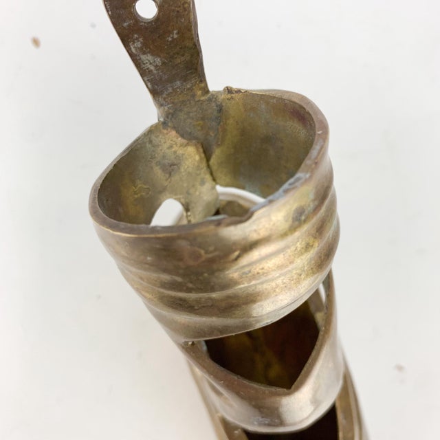 Fabulous vintage brass ballet point shoe and ribbons in brass. Hole on back for hanging. Pocket front. Great addition to...