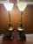 This vintage pair of Stiffel table lamps epitomizes mid-century Hollywood Regency elegance. Featuring a classical brass...