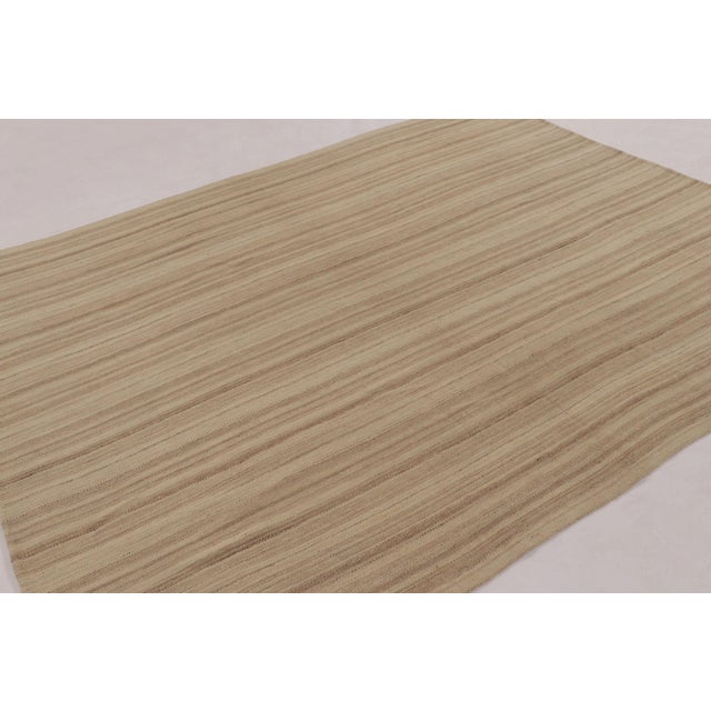 Handwoven in wool, this 8x9 contemporary Kilim is a sophisticated piece from Rug & Kilim’s “Rez Kilim” collection, an...
